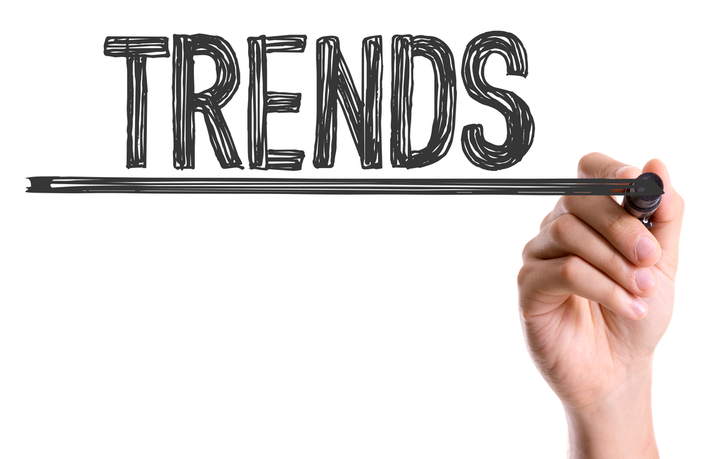 Hand With Marker Writing The Word Trends
